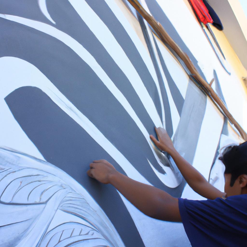 Person painting a wall mural