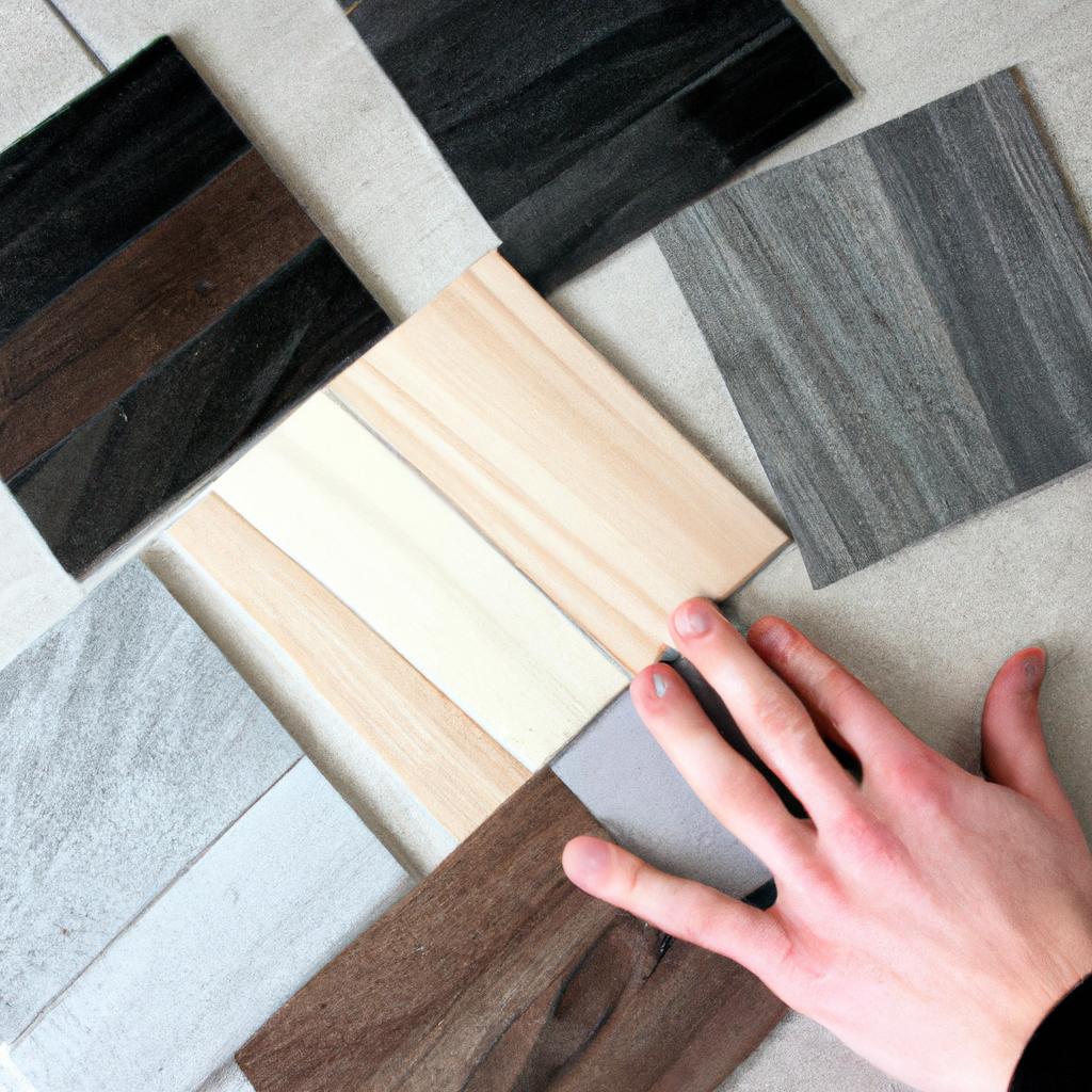 Person comparing different flooring samples